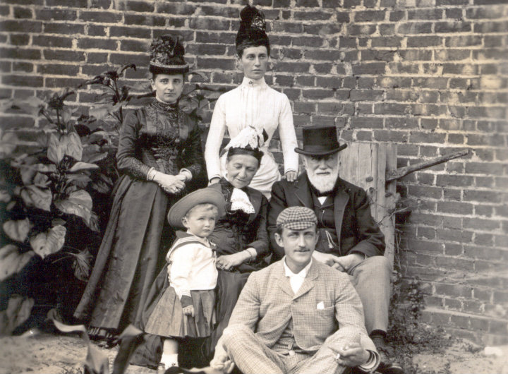 An old photograph of a family at a funeral.