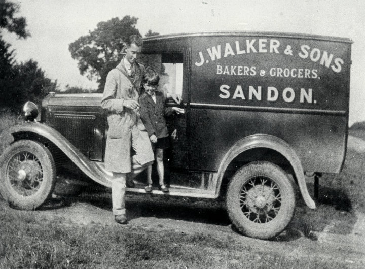 A greengrocer standing by his van in 1930.